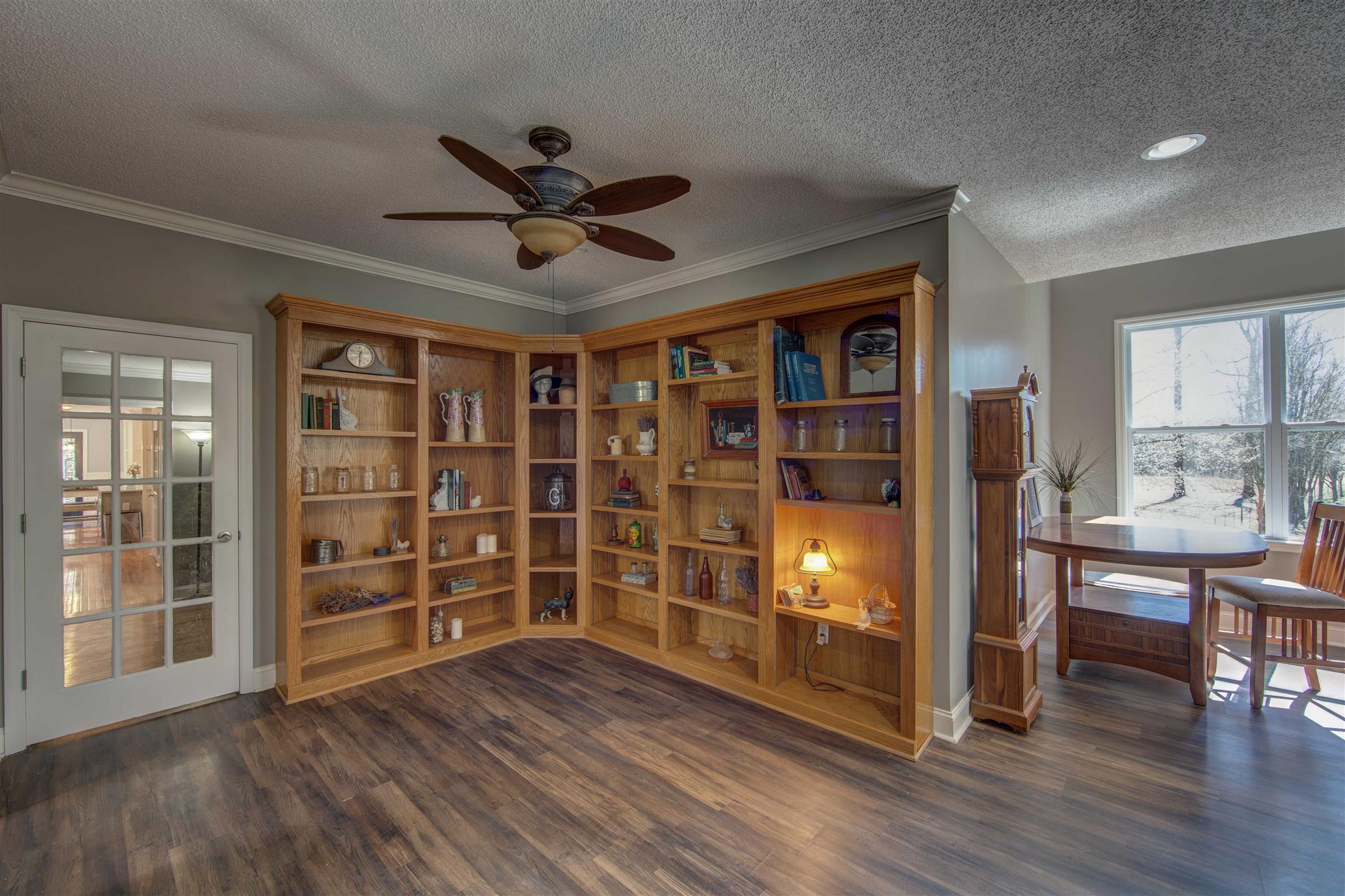 700 Baker Road Columbia, TN 38401 - Photo 20 of 30 a view of an empty room with a window and wooden floor