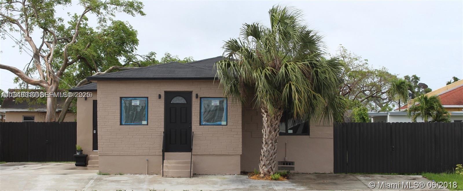 107 West Pembroke Road Hallandale Beach, FL 33009 - Photo 3 of 7 a front view of a house