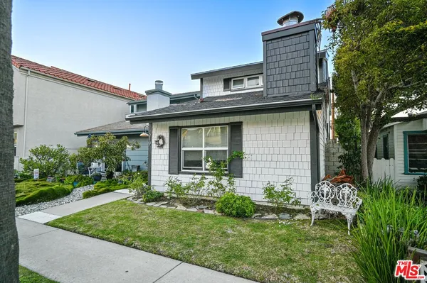 a house view with a garden space