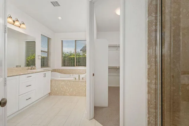 a bathroom with a toilet and a window