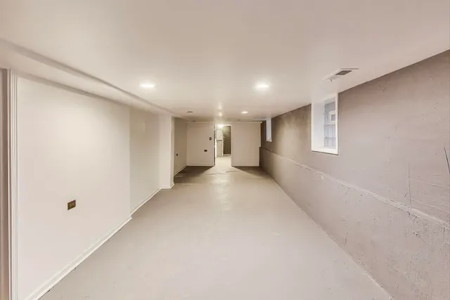 a view of a room with white walls