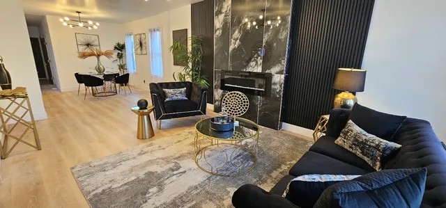 a bedroom with furniture and a mirror