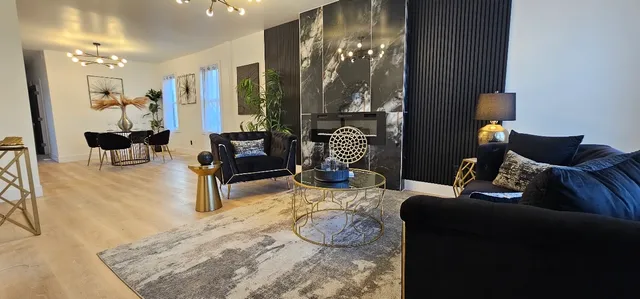 a living room with furniture and a lamp