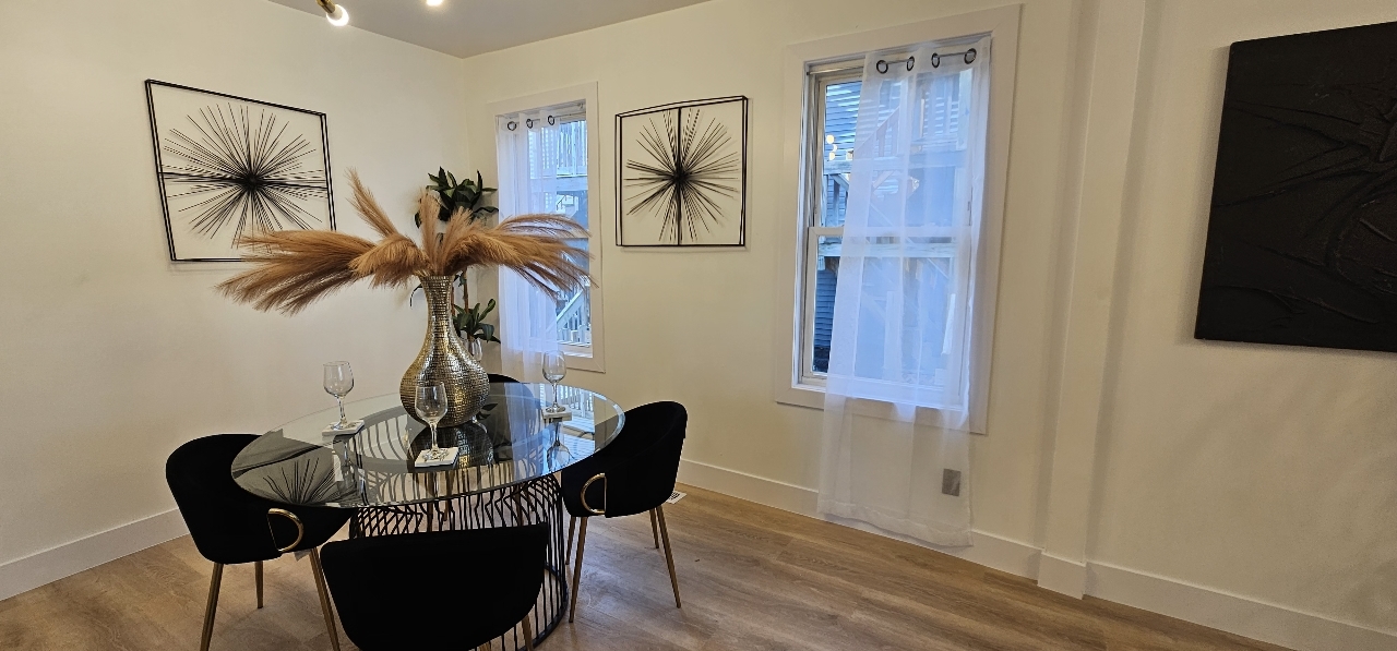 1117 West 57th Street Chicago, IL 60621 - Photo 4 of 24 a view of a dining room with furniture and wooden floor