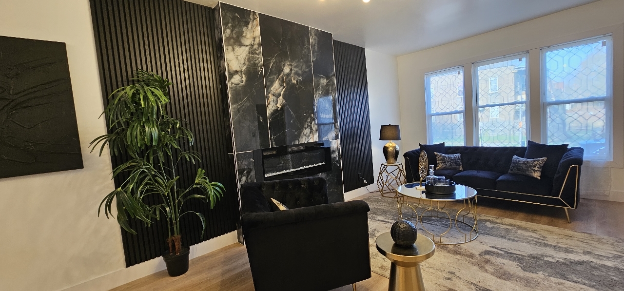 1117 West 57th Street Chicago, IL 60621 - Photo 5 of 24 a living room with furniture a potted plant and a rug