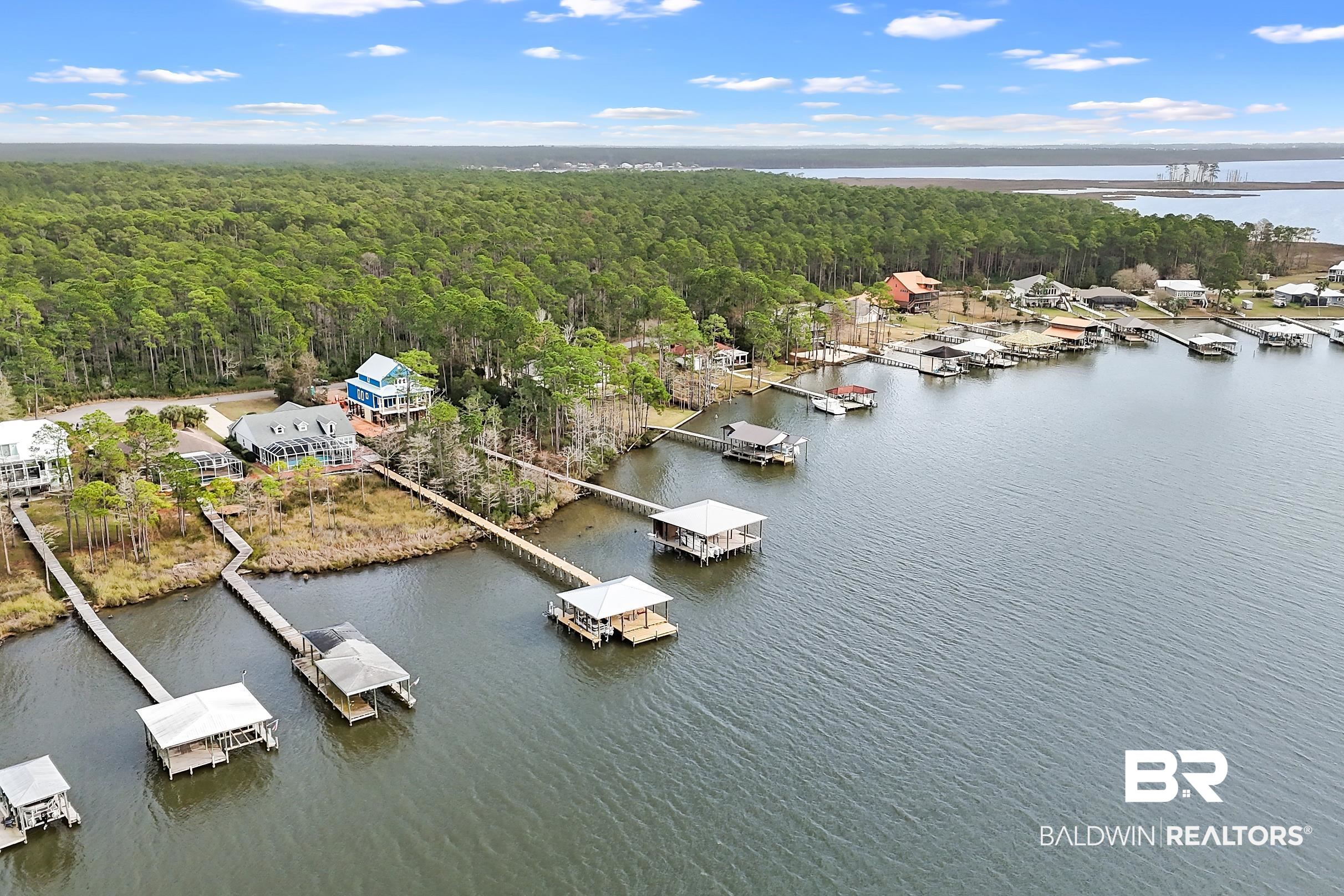 8591 Bay Harbor Road Elberta, AL 36530 - Photo 7 of 56 Drone / aerial view of a nearby body of water and a marina
