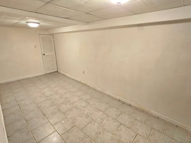 a view of a room with white walls