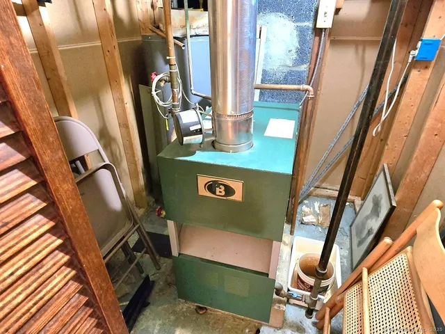 a view of living room with furniture and a mirror