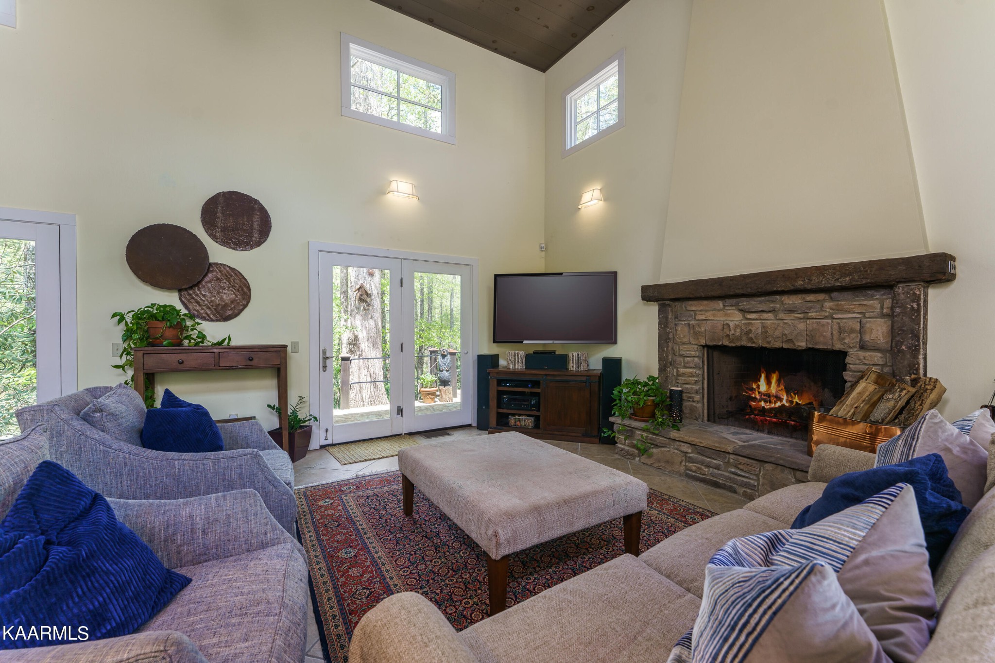 4614 Whetstone Road Sevierville, TN 37862 - Photo 4 of 60 a living room with furniture a fireplace and a flat screen tv
