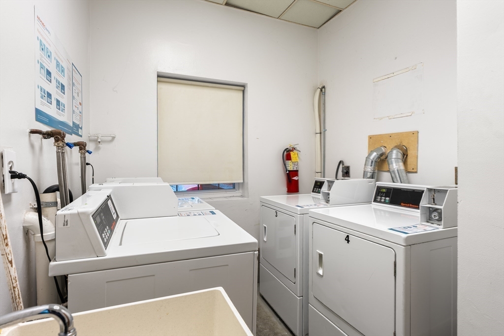 1691 Cambridge Street, Unit 42 Cambridge, MA 02138 - Photo 12 of 16 a utility room with dryer and washer