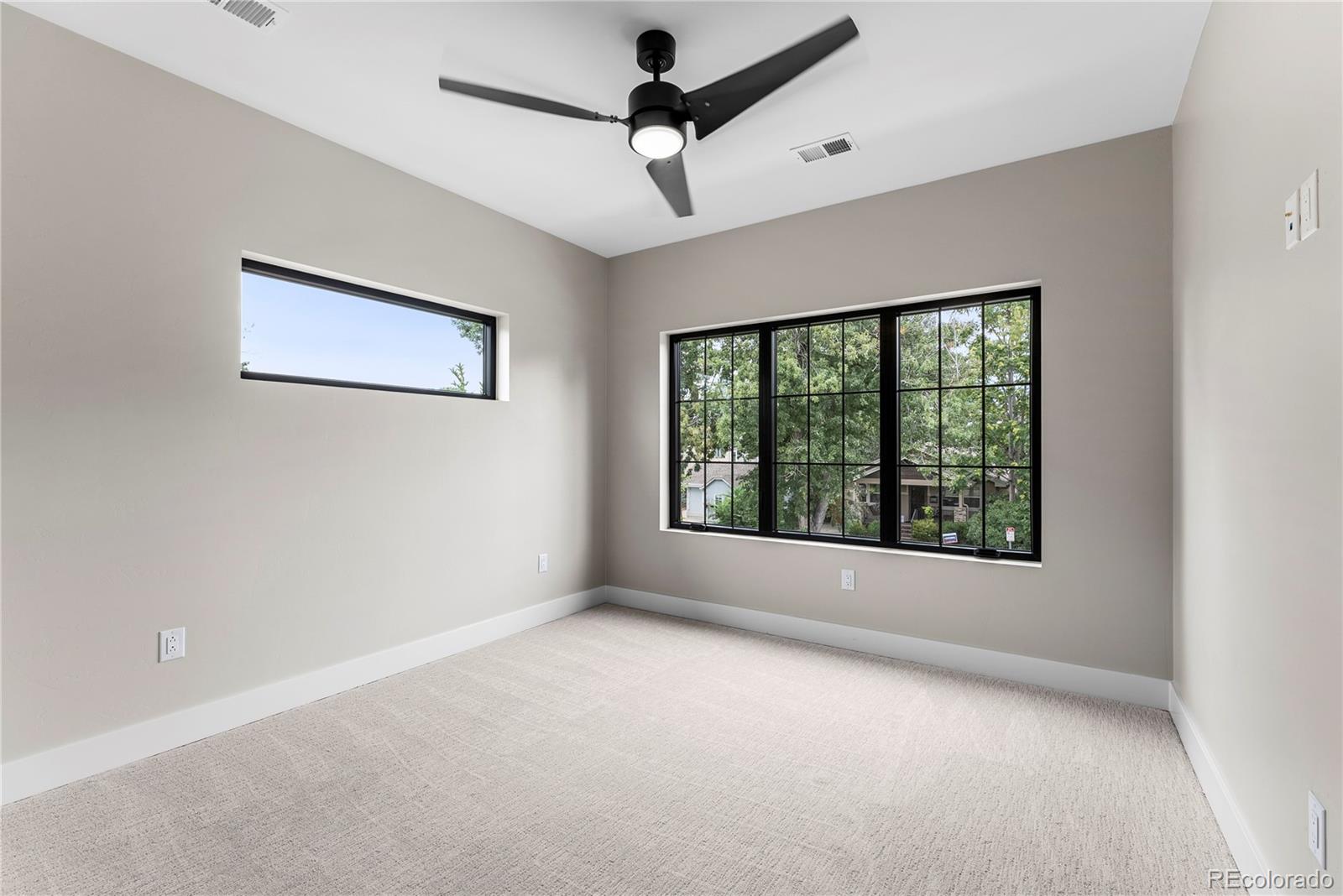 4494 Meade Street Denver, CO 80211 - Photo 13 of 36 a view of an empty room with windows