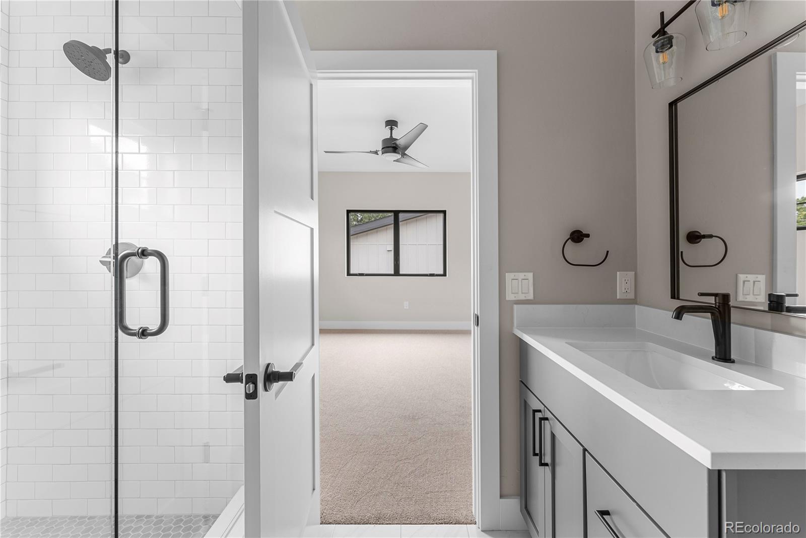 4494 Meade Street Denver, CO 80211 - Photo 16 of 36 a bathroom with a sink and mirror