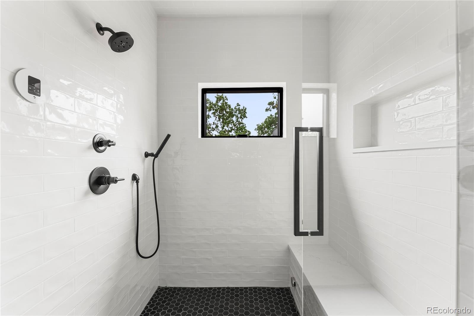 4494 Meade Street Denver, CO 80211 - Photo 19 of 36 a bathroom with a shower