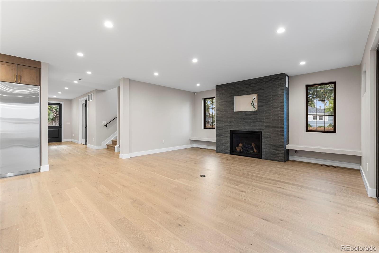 4494 Meade Street Denver, CO 80211 - Photo 3 of 36 a view of an empty room with a fireplace