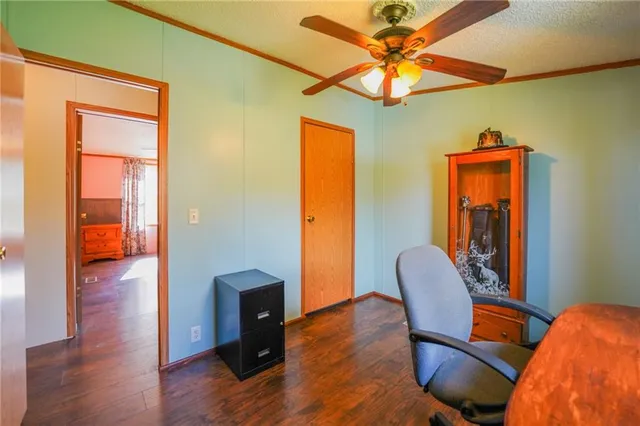 a bathroom with a toilet and a shower curtain