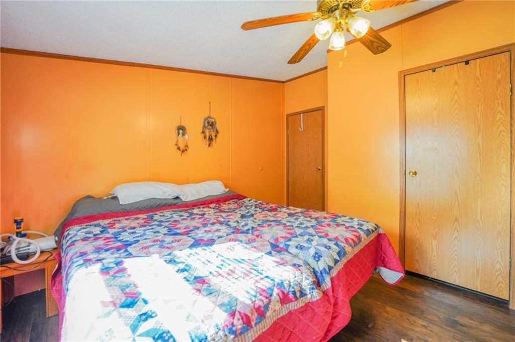 204 Hollowvue Road Wampum, PA 16157 - Photo 30 of 46 a bedroom with a bed and a painting on the wall