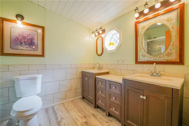 a bathroom with a toilet sink and a shower