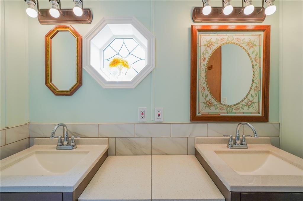 204 Hollowvue Road Wampum, PA 16157 - Photo 32 of 46 a bathroom with a sink mirror and vanity