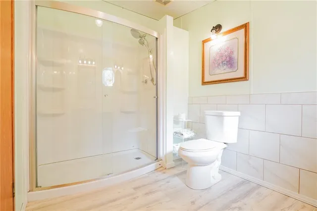 a wooden deck with sunset view