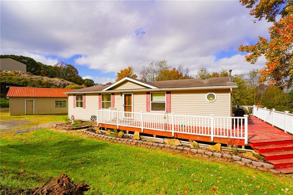 204 Hollowvue Road Wampum, PA 16157 - Photo 4 of 46 a front view of a house with a yard