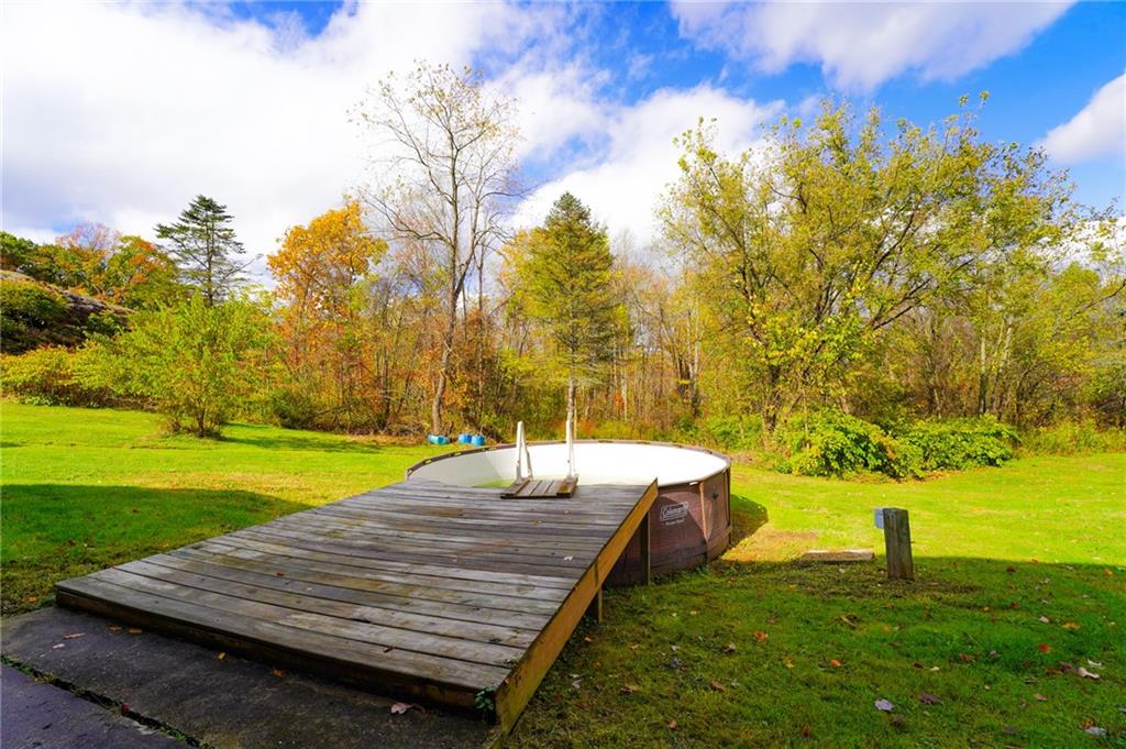 204 Hollowvue Road Wampum, PA 16157 - Photo 41 of 46 a wooden deck with sunset view