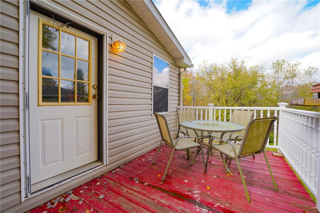 204 Hollowvue Road Wampum, PA 16157 - Photo 45 of 46 a view of a chair and table on the deck