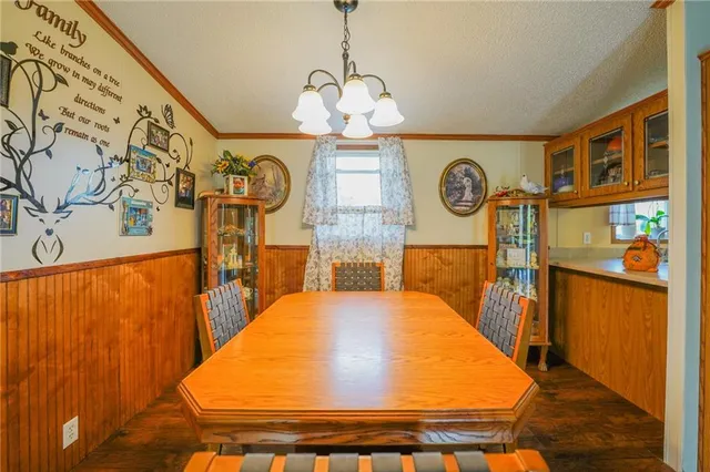 a kitchen with stainless steel appliances a stove a sink and a refrigerator
