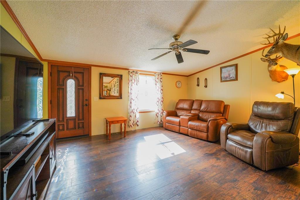 204 Hollowvue Road Wampum, PA 16157 - Photo 10 of 46 a living room with furniture and a flat screen tv
