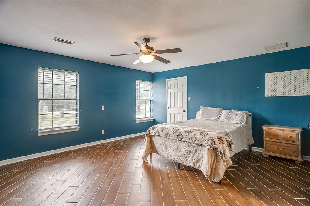 1050 Hampel Road Palmer, TX 75152 - Photo 26 of 35 a bedroom with a bed dresser and a window