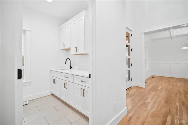 a view of kitchen living room with wooden floor and electronic appliances