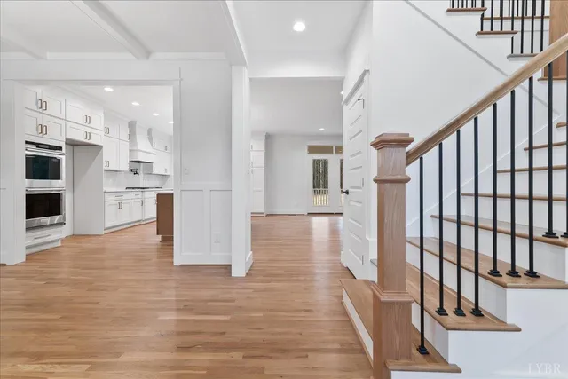 a kitchen with granite countertop a sink stainless steel appliances and cabinets