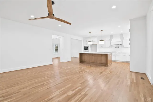 a view of room with window and hardwood floor