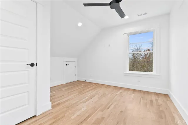 a bathroom with a double vanity sink a toilet and a shower