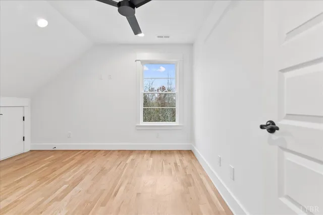 a view of a balcony with a floor to ceiling window and wooden floor