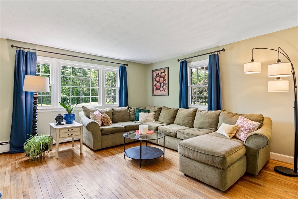 21 Boutwell Road Andover, MA 01810 - Photo 11 of 37 a living room with furniture and a large window