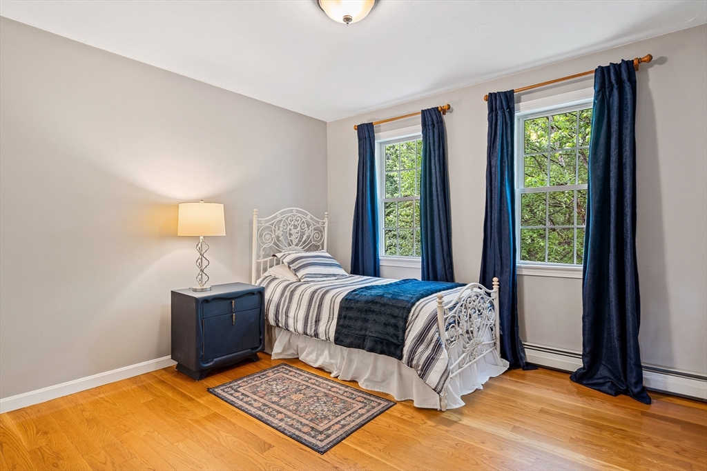 21 Boutwell Road Andover, MA 01810 - Photo 21 of 37 a living room with a bed furniture and a window