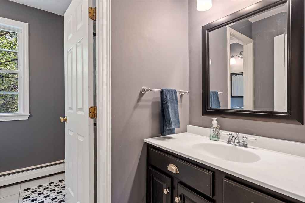 21 Boutwell Road Andover, MA 01810 - Photo 23 of 37 a bathroom with a sink and a mirror