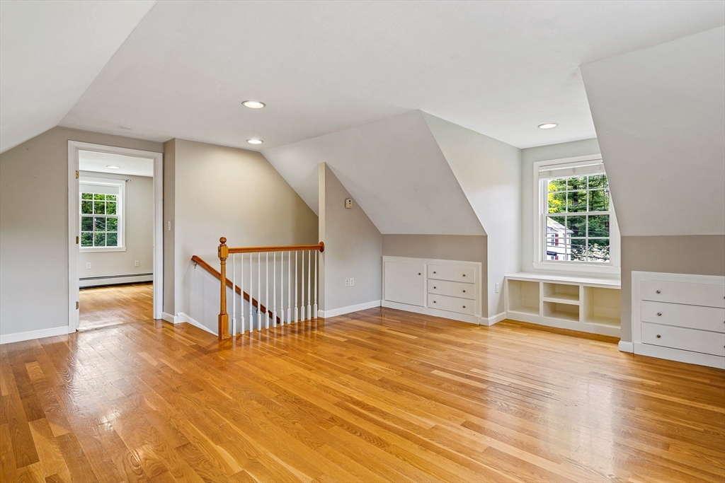 21 Boutwell Road Andover, MA 01810 - Photo 28 of 37 a view of an empty room with wooden floor and a window