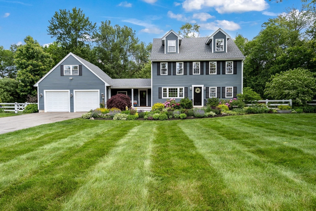 21 Boutwell Road Andover, MA 01810 - Photo 31 of 37 a front view of a house with a yard and trees