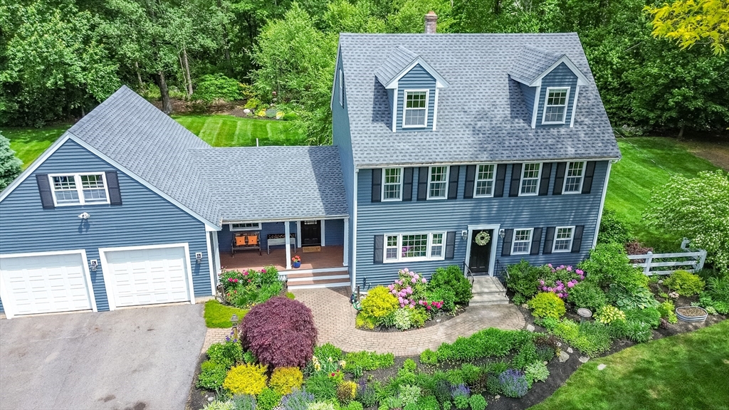 21 Boutwell Road Andover, MA 01810 - Photo 4 of 37 a aerial view of a house with a yard and potted plants