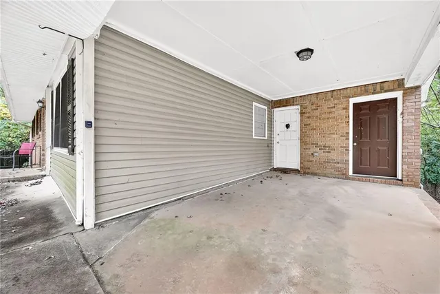 a view of a house with garage and flat screen tv