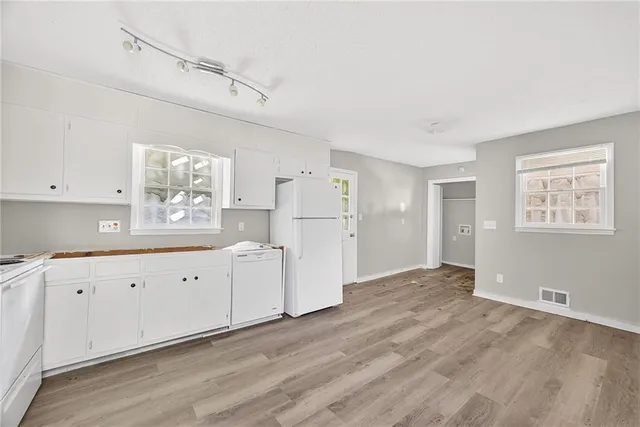a view of a kitchen with electric appliances