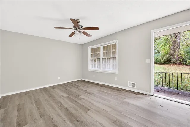 a view of an empty room with a window