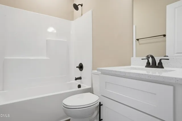 a bathroom with a sink a toilet and a bathtub