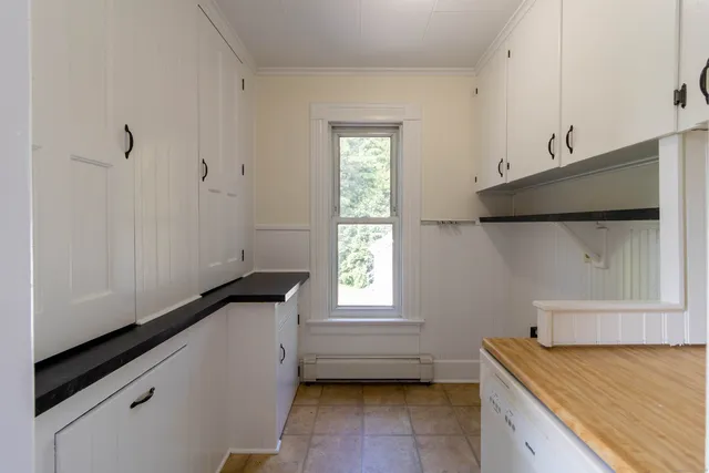 a kitchen with a cabinets and window