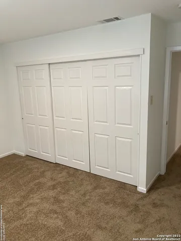 a white toilet sitting next to a bath tub