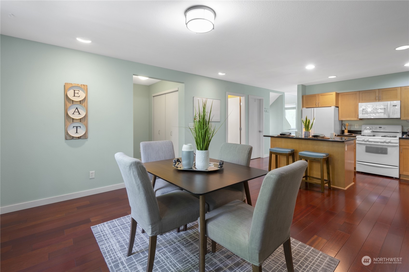 6713 35th Place South Seattle, WA 98118 - Photo 11 of 30 a view of a dining room with furniture and wooden floor