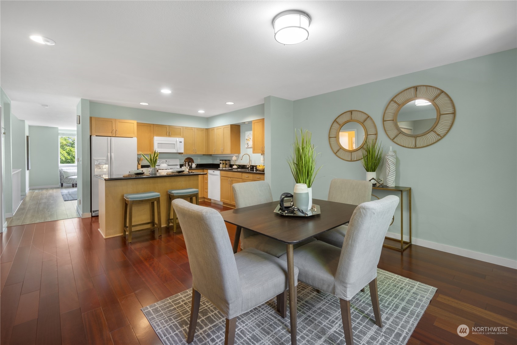 6713 35th Place South Seattle, WA 98118 - Photo 12 of 30 a view of a dining room with furniture and wooden floor