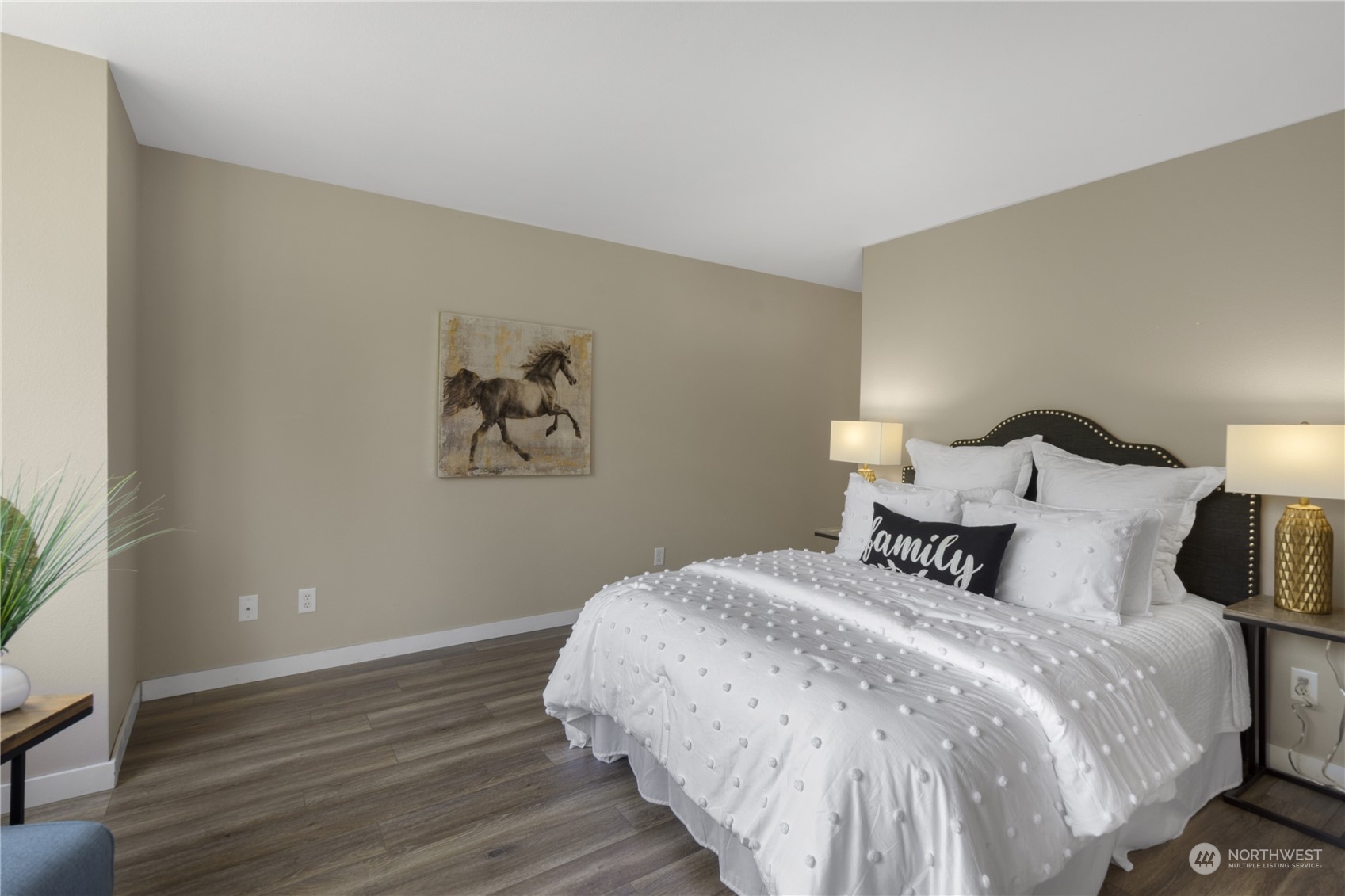 6713 35th Place South Seattle, WA 98118 - Photo 13 of 30 a bedroom with a bed and wooden floor