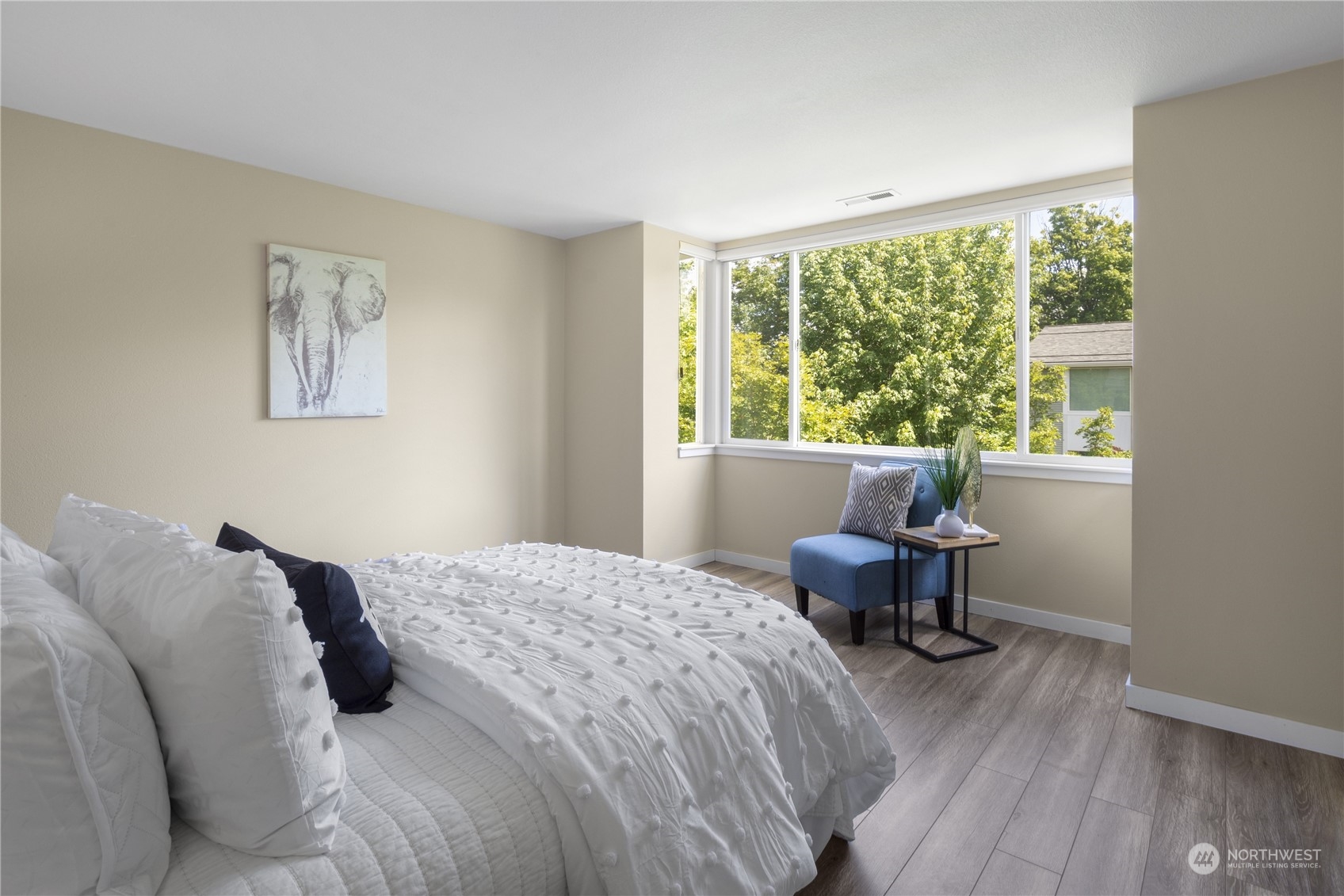 6713 35th Place South Seattle, WA 98118 - Photo 14 of 30 a bedroom with a bed and wooden floor